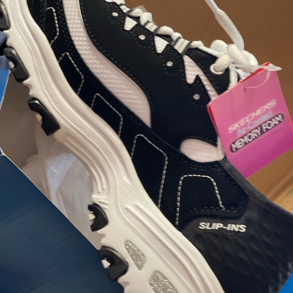 Skechers Black and White Hands free Slip-Ins Sneakers